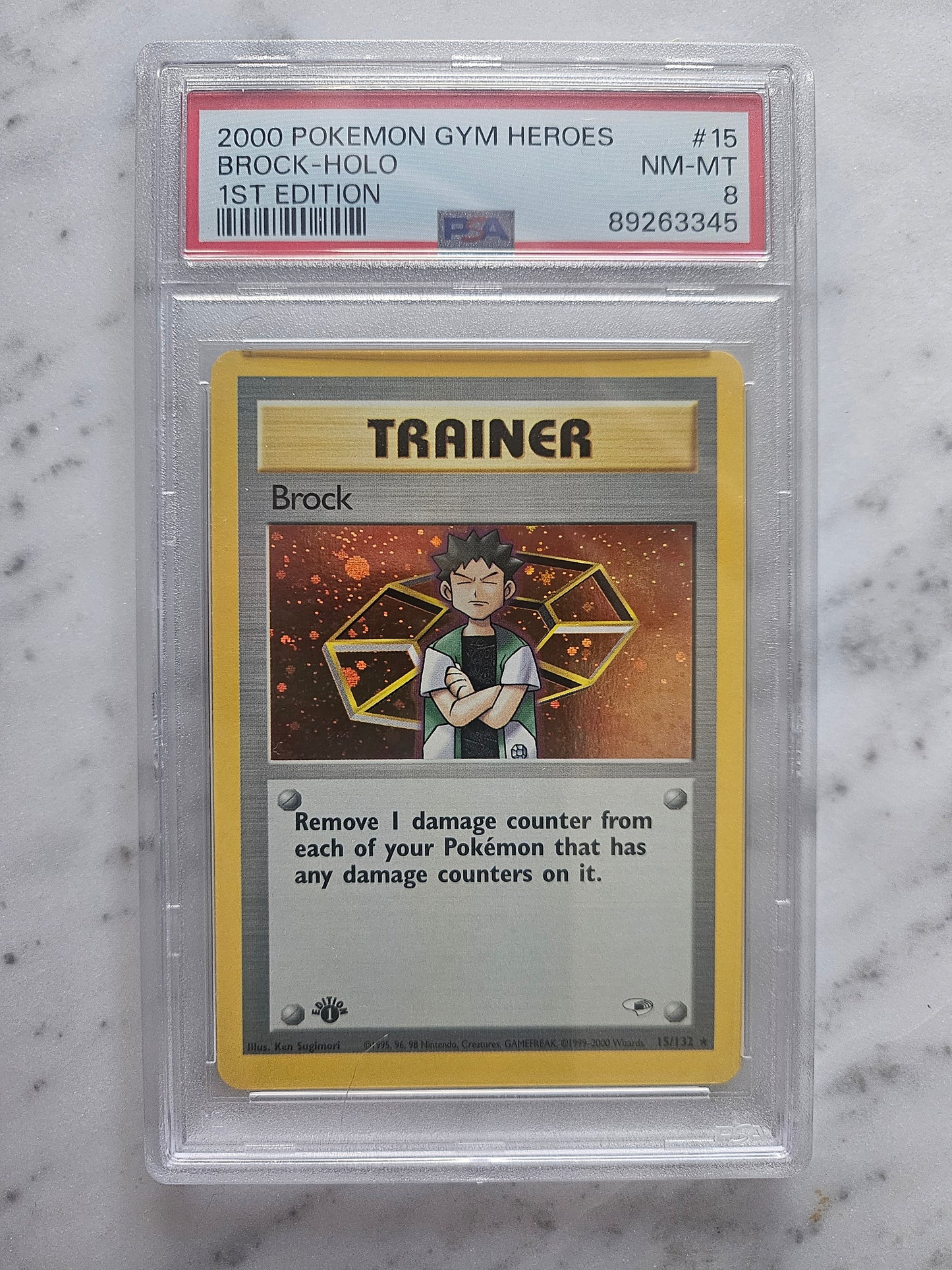 PSA 8 Brock Trainer 1st Edition Gym Heroes 15/132 Pokemon Card MINT Holo