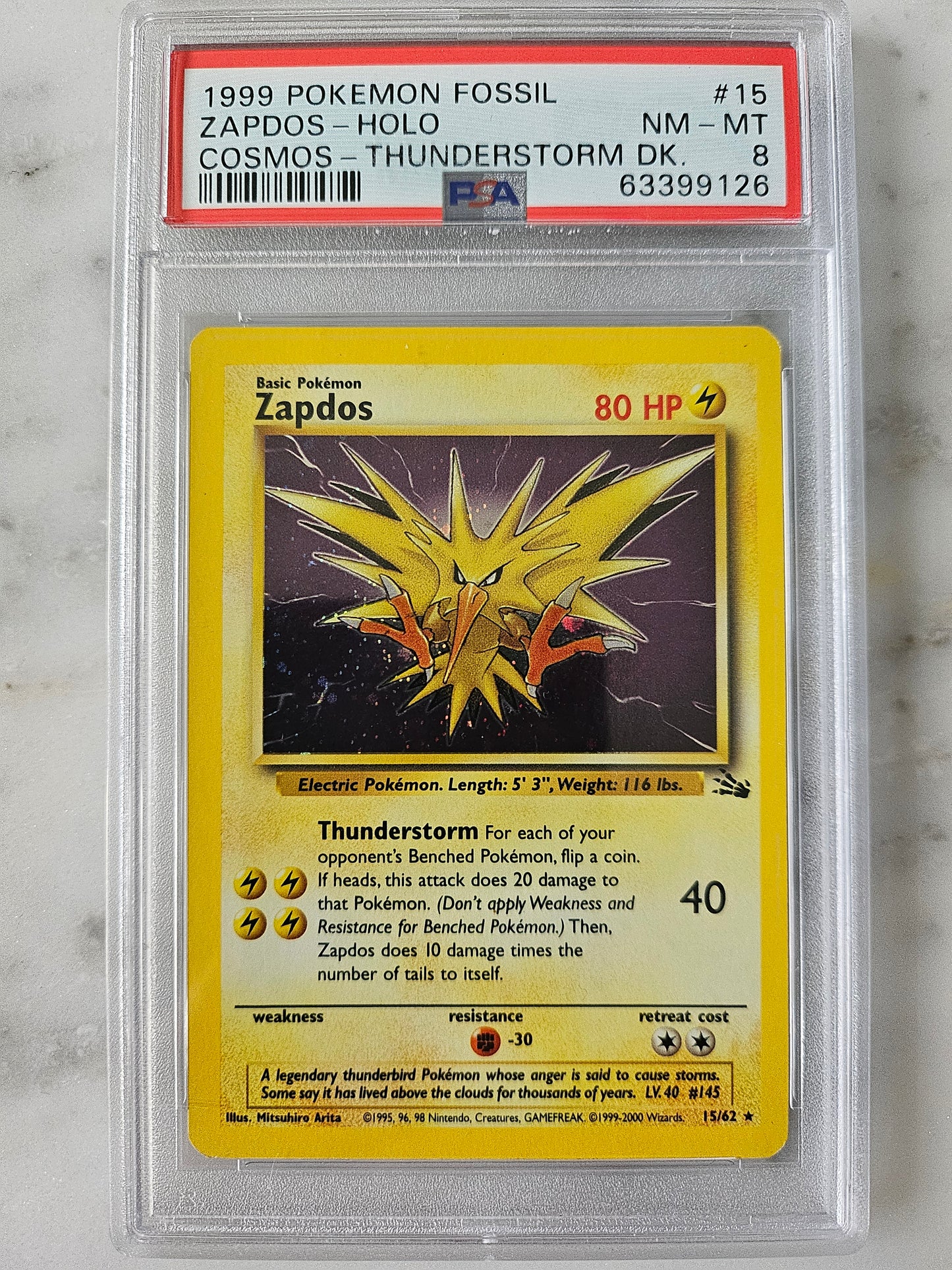 1999 Pokemon TCG Zapdos Holo Fossil Cosmos Thunderstorm PSA 8 NM-MT